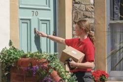 postwoman delivering